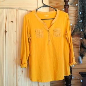 Kim Rogers yellow shirt